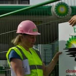 Demonstrators hang signs on a fence they have used to barricade a BP station in London, July 27, 2010. (AFP/Getty Images)