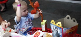 Dylan Maki, 4, of Evanston, plays with his Happy Meal toy outside of the McDonald's at Navy Pier on July 7, 2010. (William DeShazer/Chicago Tribune)