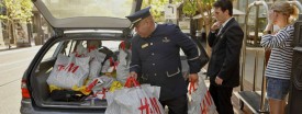 A concierge and a valet assist a shopper at a mall in Glendale, Calif., Aug. 30, 2010. (AP Photo/Damian Dovarganes)