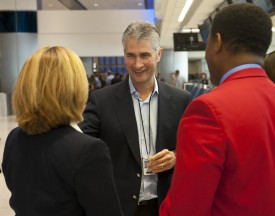 Continental Airlines CEO  Jeff Smisek, center, talks with two Continental employees on Sept. 23, 2010, in Houston. (Tribune)