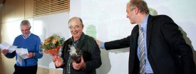 American economist Dale Mortensen, 71, center, is welcomed to a press conference at the University of Aarhus, in Aarhus, Denmark, Monday Oct. 11, 2010. (Polfoto/Andreas Szlavik)