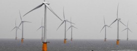 A boat powers past the Thanet Offshore Wind Farm, the world's largest operational offshore wind farm, off the Kent coast in southern England, Sept. 23, 2010. (Reuters/Stefan Wermuth)