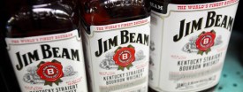 Bottles of Jim Beam bourbon sit on a shelf in a liquor store in Deerfield, Illinois, U.S., on Nov. 1, 2010. (Tim Boyle/Bloomberg)